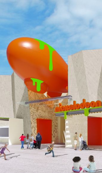 A Group Of People Standing In Front Of A Mountain